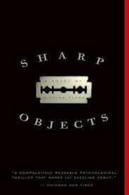 Cover of Sharp Objects.  A metal plaque against a black background.    
