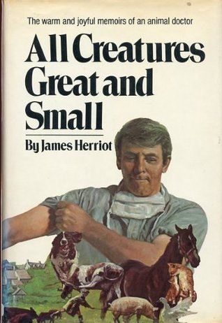Cover of all creatures great and small.  A young man, surrounded by animals, rolls up a sleeve.